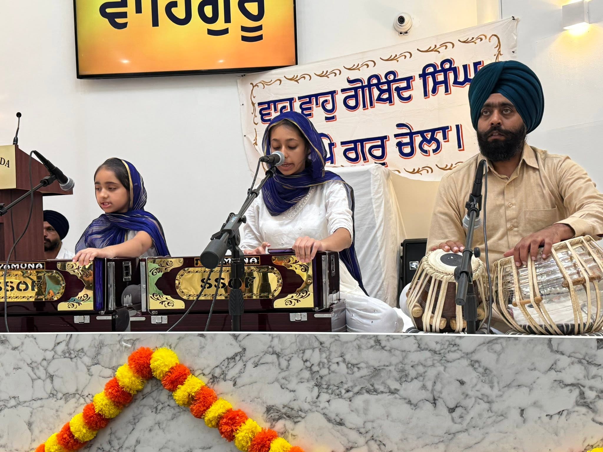 A family performing Kirtan together